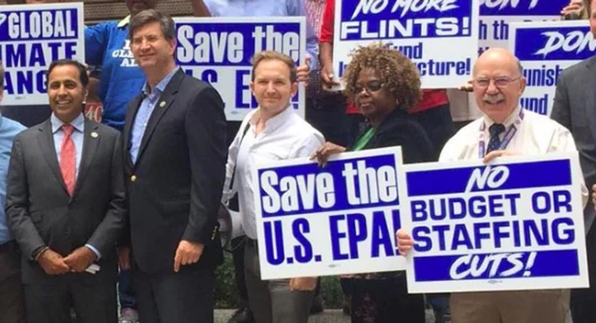 Save the U.S. EPA rally with AFGE Council 238 members and supporters holding signs against budget and staffing cuts.