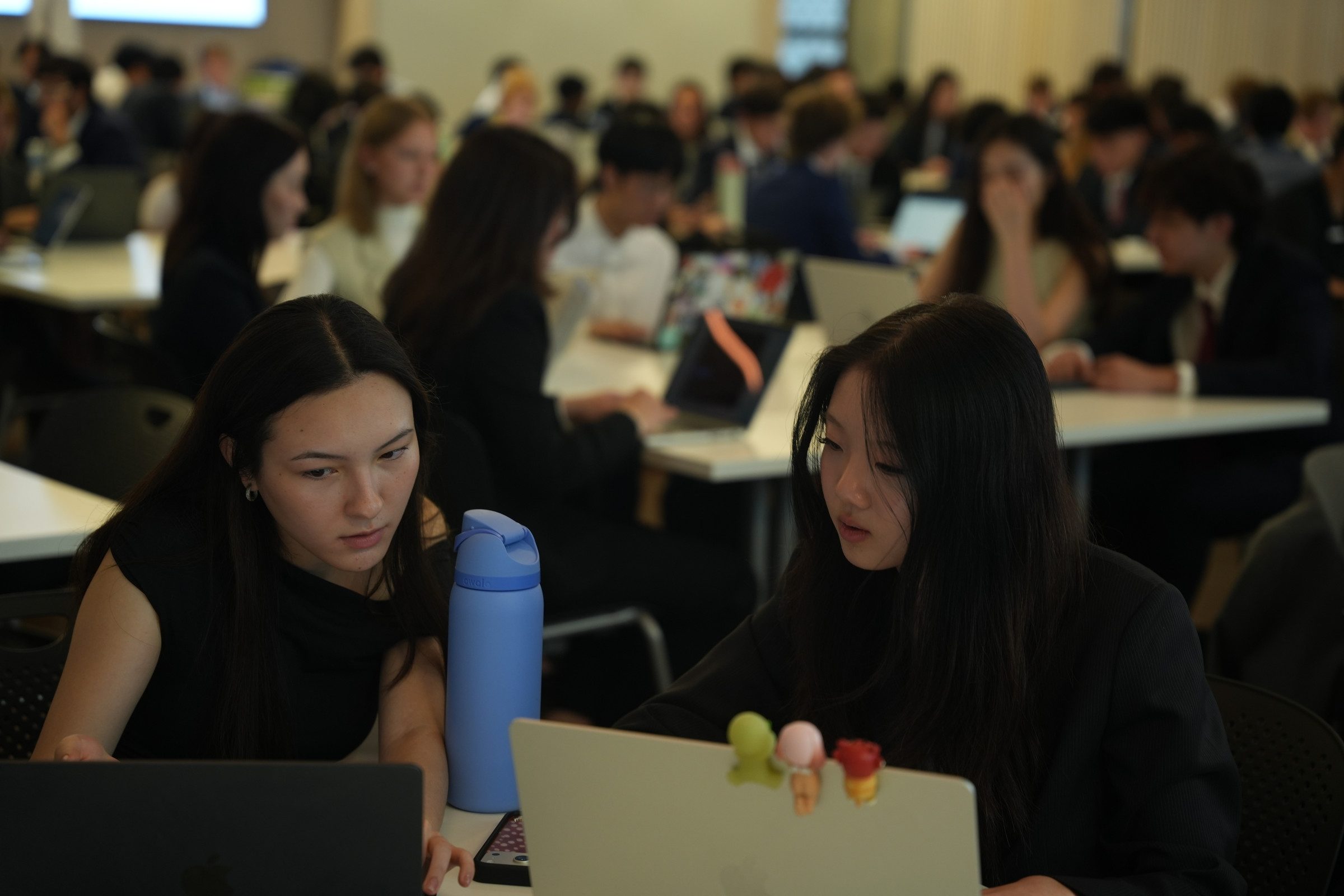 Two students working through a Training Program exercise