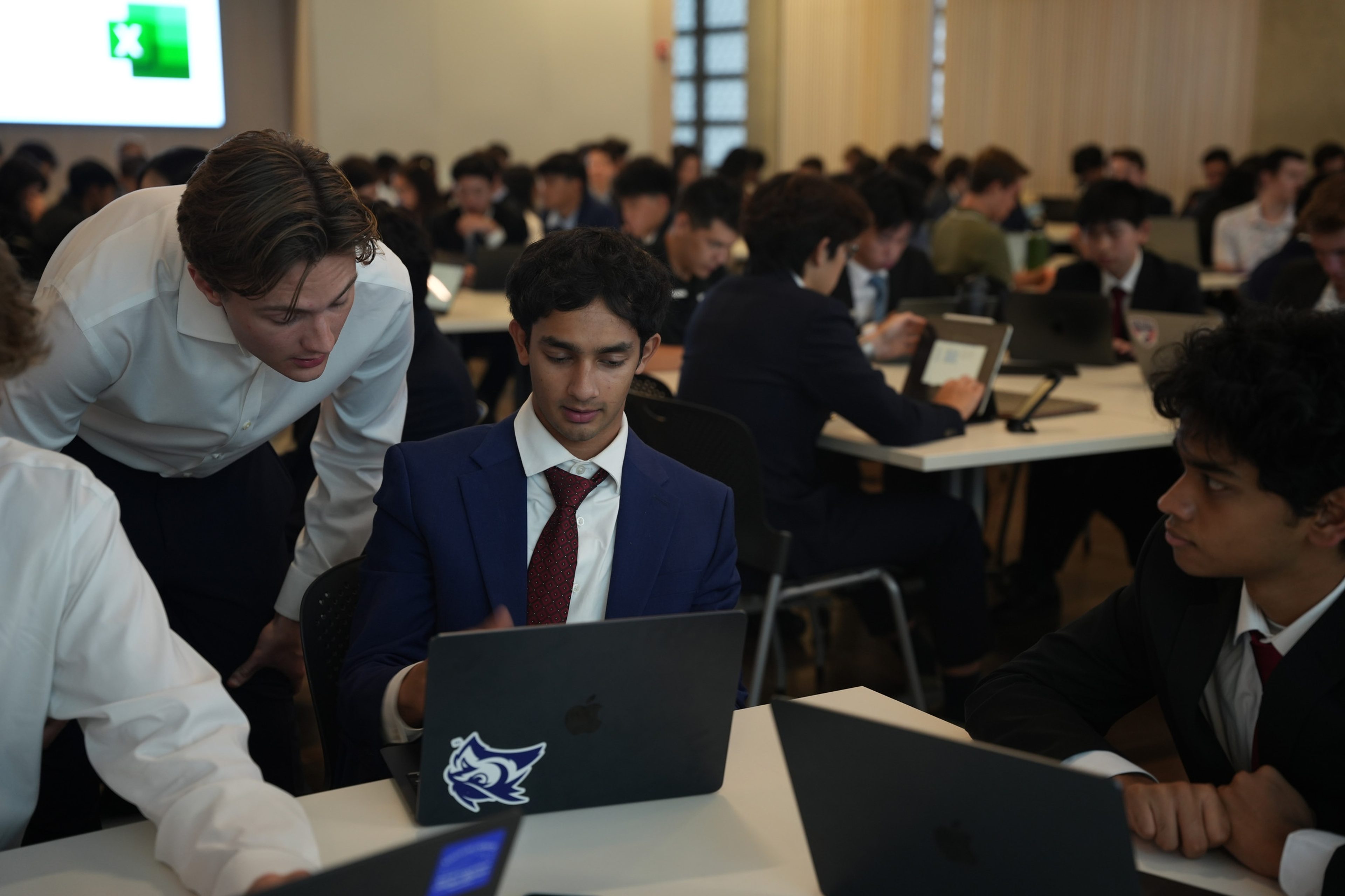 A Training Director helping a student during a Training Program session