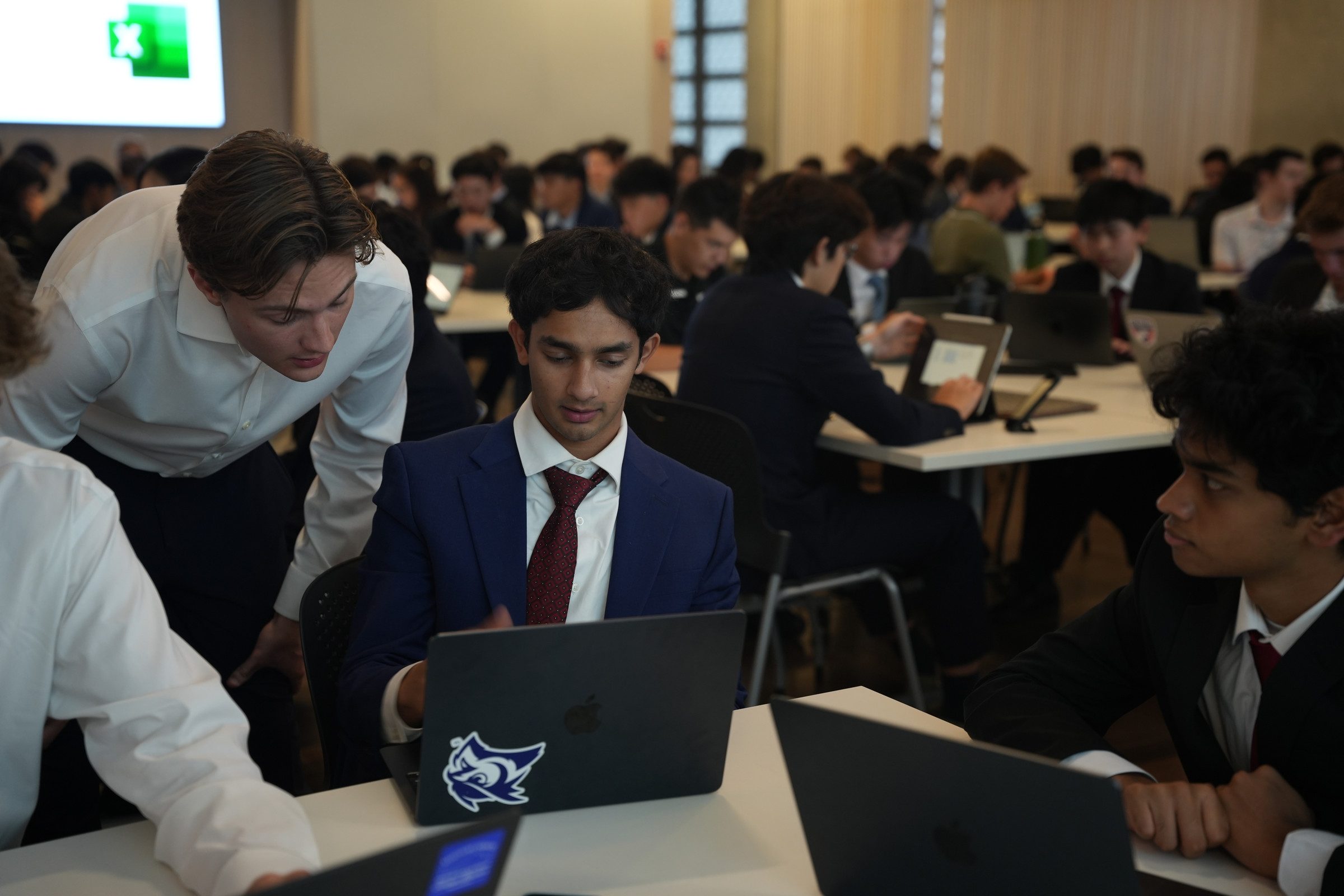 A Training Director helping a student during a Training Program session