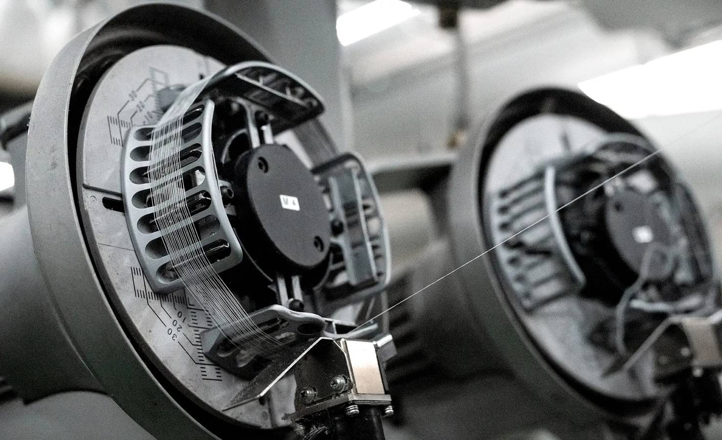 Photograph of Pertex weaving machines in action, offering a glimpse into the manufacturing process of their pioneering high-performance fabrics.