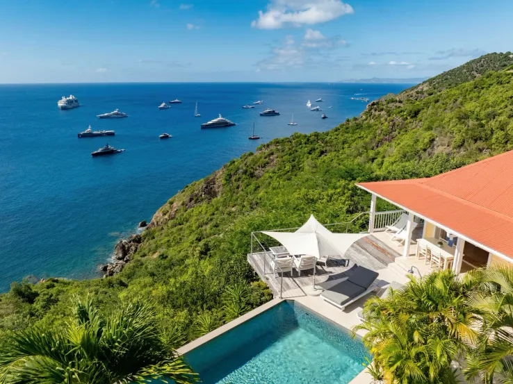 Photograph of a luxury Sibarth villa featuring a private infinity pool overlooking the Caribbean Sea