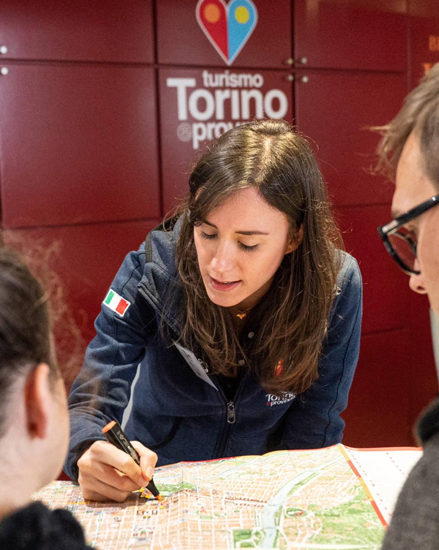 Photograph taken inside a Turismo Torino e Provincia visitor's center, illustrating the support provided to frontline staff who use the TTP backend system and generated resources.