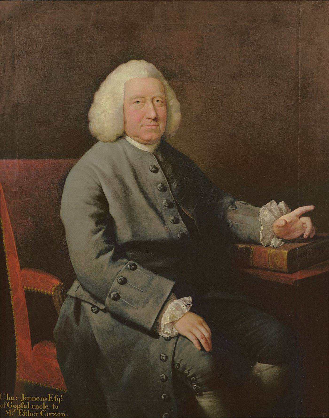 Oil portrait of an elderly man in a white wig and grey coat, seated in a red chair and pointing toward a book on the table beside him