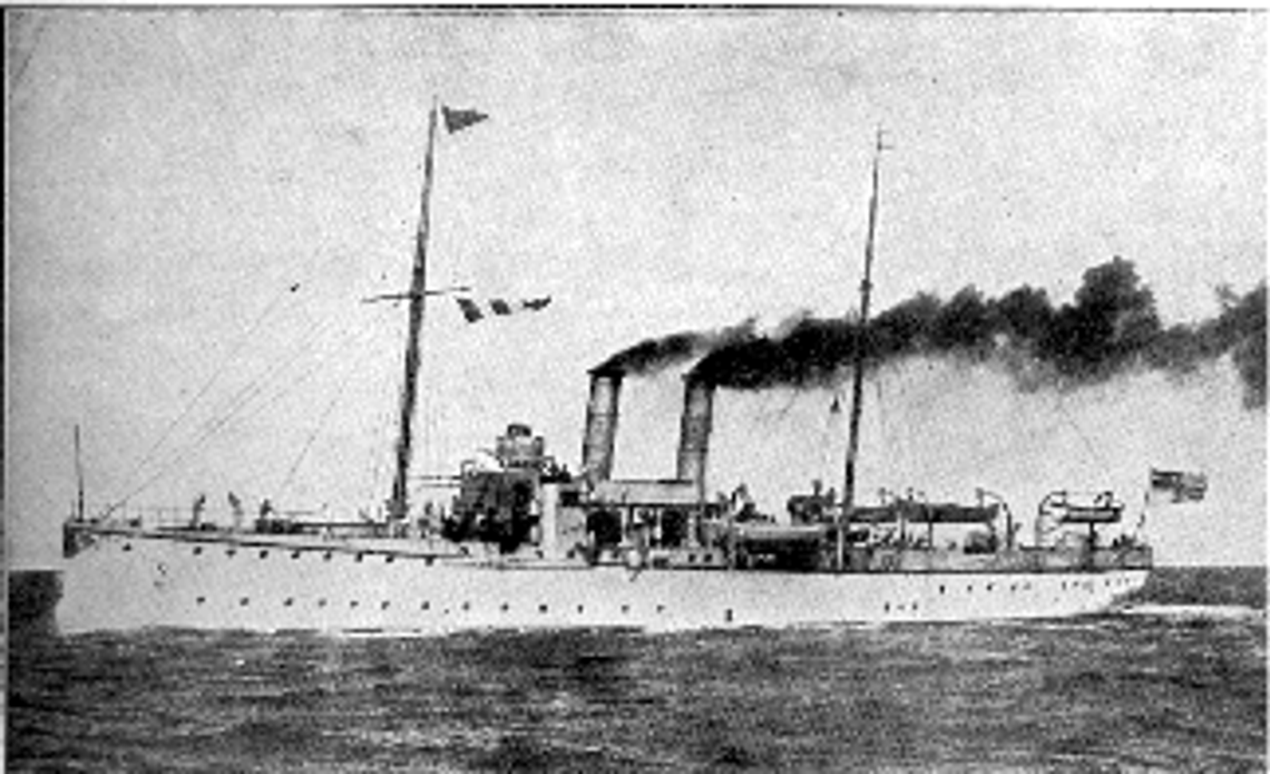 Steam-powered warship with two tall masts and multiple smokestacks, flying flags, photographed at sea in black and white. SMS Panther