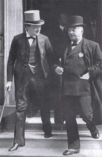 Two men in formal attire with top hats standing outside a building, engaged in conversation.