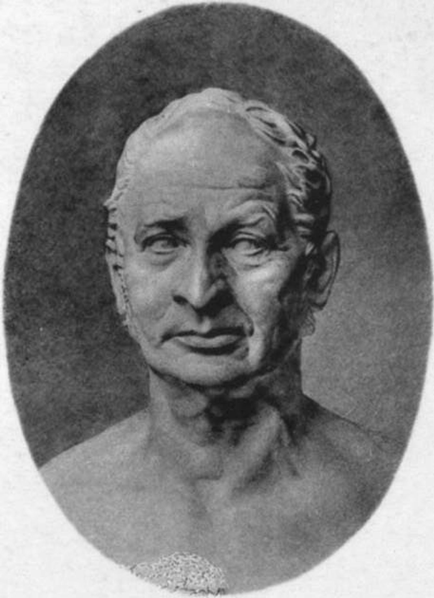 Oval black-and-white portrait of an elderly man with receding grey hair and a lined face