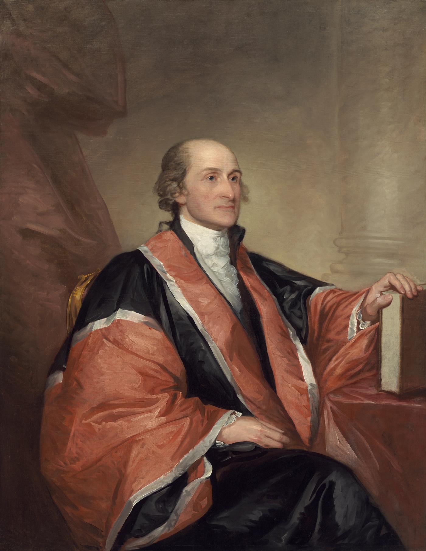 Portrait of John Jay seated in black and salmon judicial robes trimmed in white, his hand resting on a book, with a column behind him