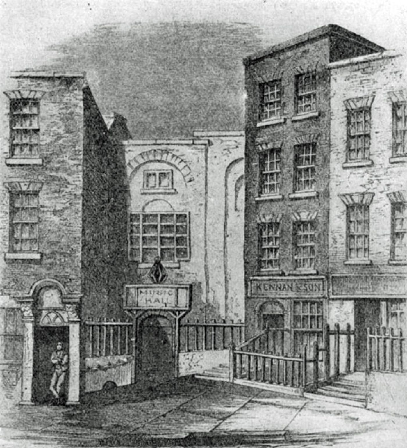 Engraving of a narrow street with tall brick buildings on either side of a recessed hall with an arched doorway and a railed forecourt