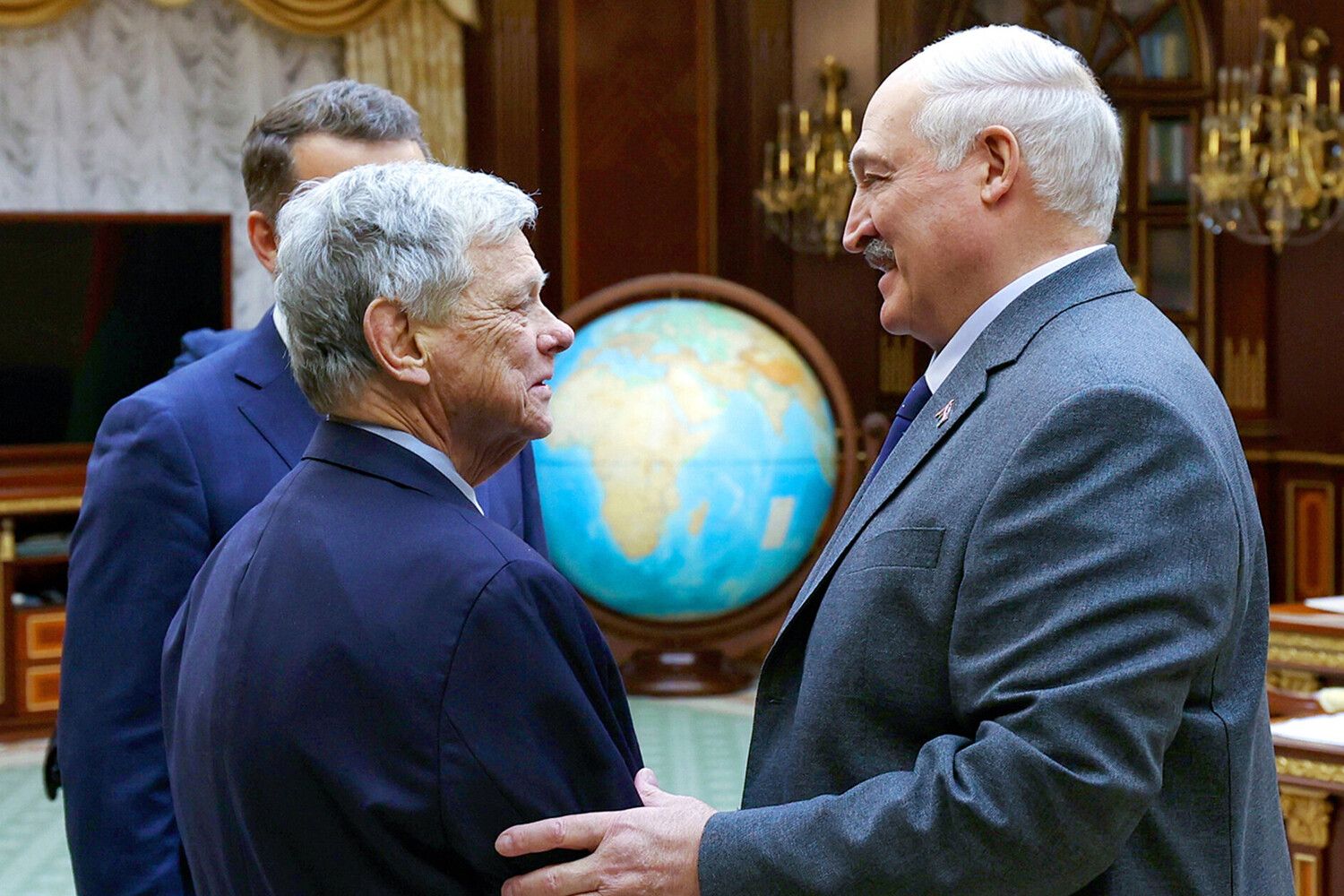 Belarusian President Alexander Lukashenko and U.S. Presidential envoy John Coale shake hands during their meeting in Minsk, Belarus on December 12, 2025. 