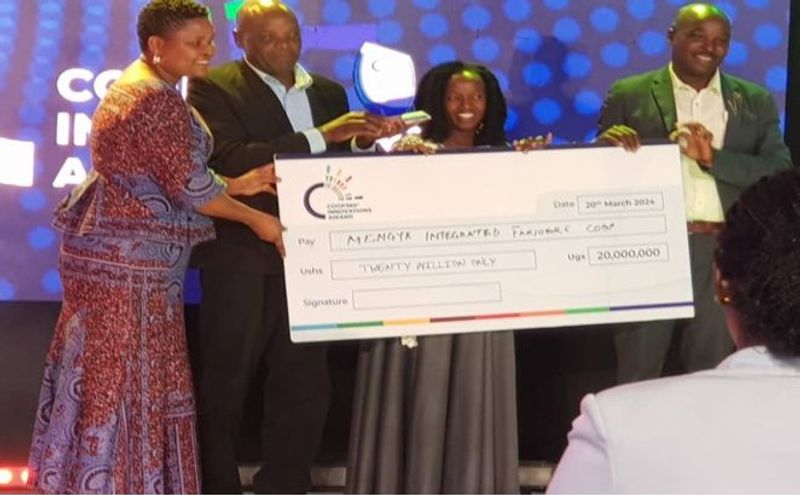 Mkongya Integrated Farmers' Cooperative receives its award cheque