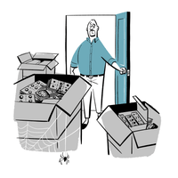 Danny looking at boxes of medicines in his spare room