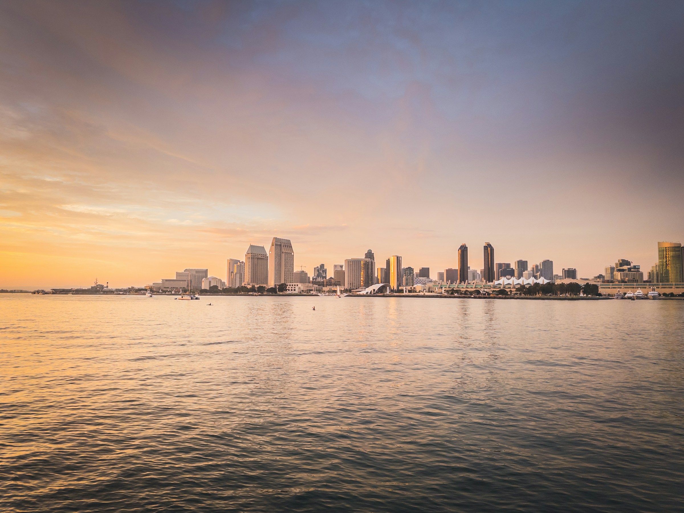 City skyline across the water at sunset