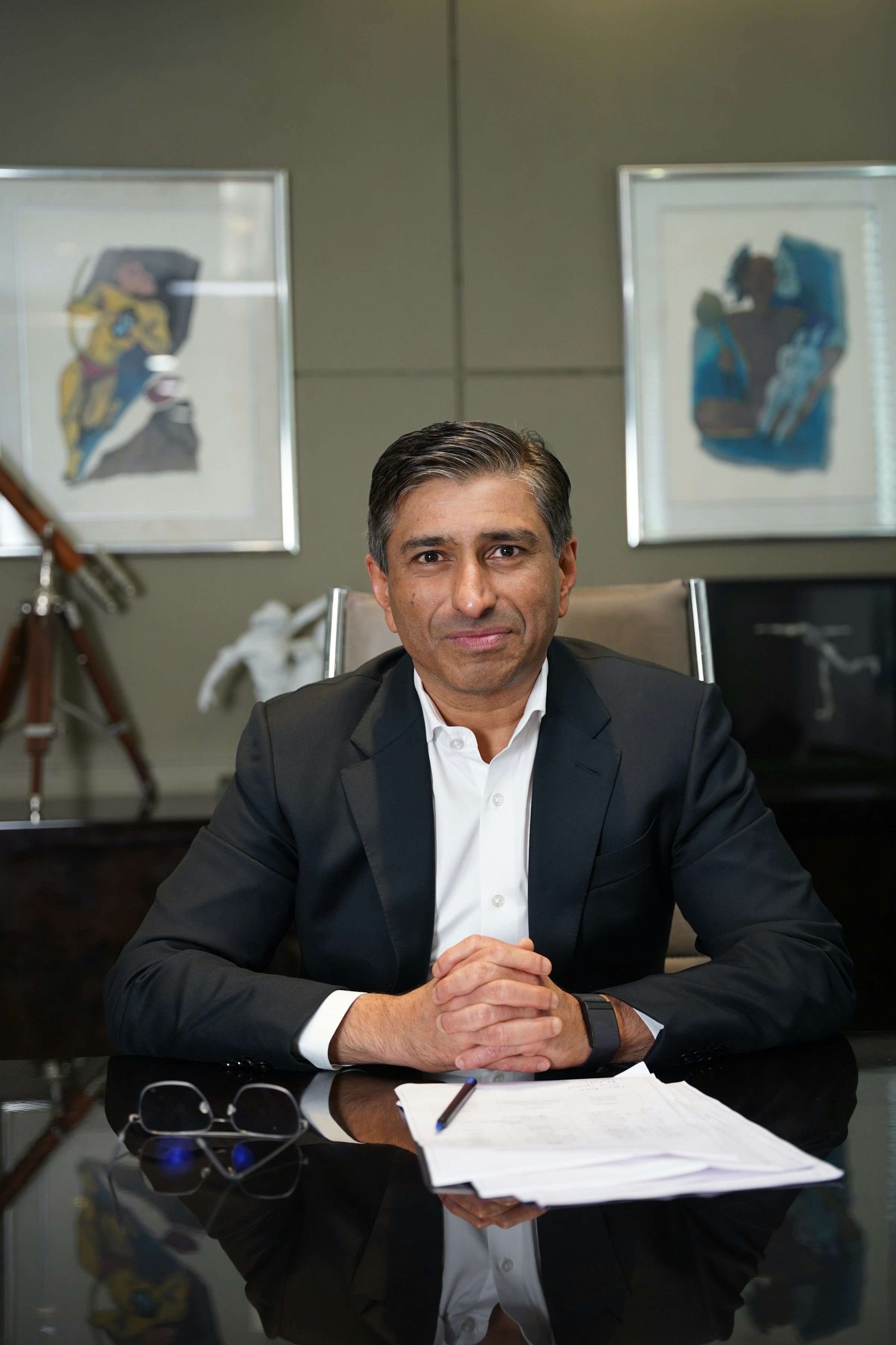 Attorney in a suit seated at a desk