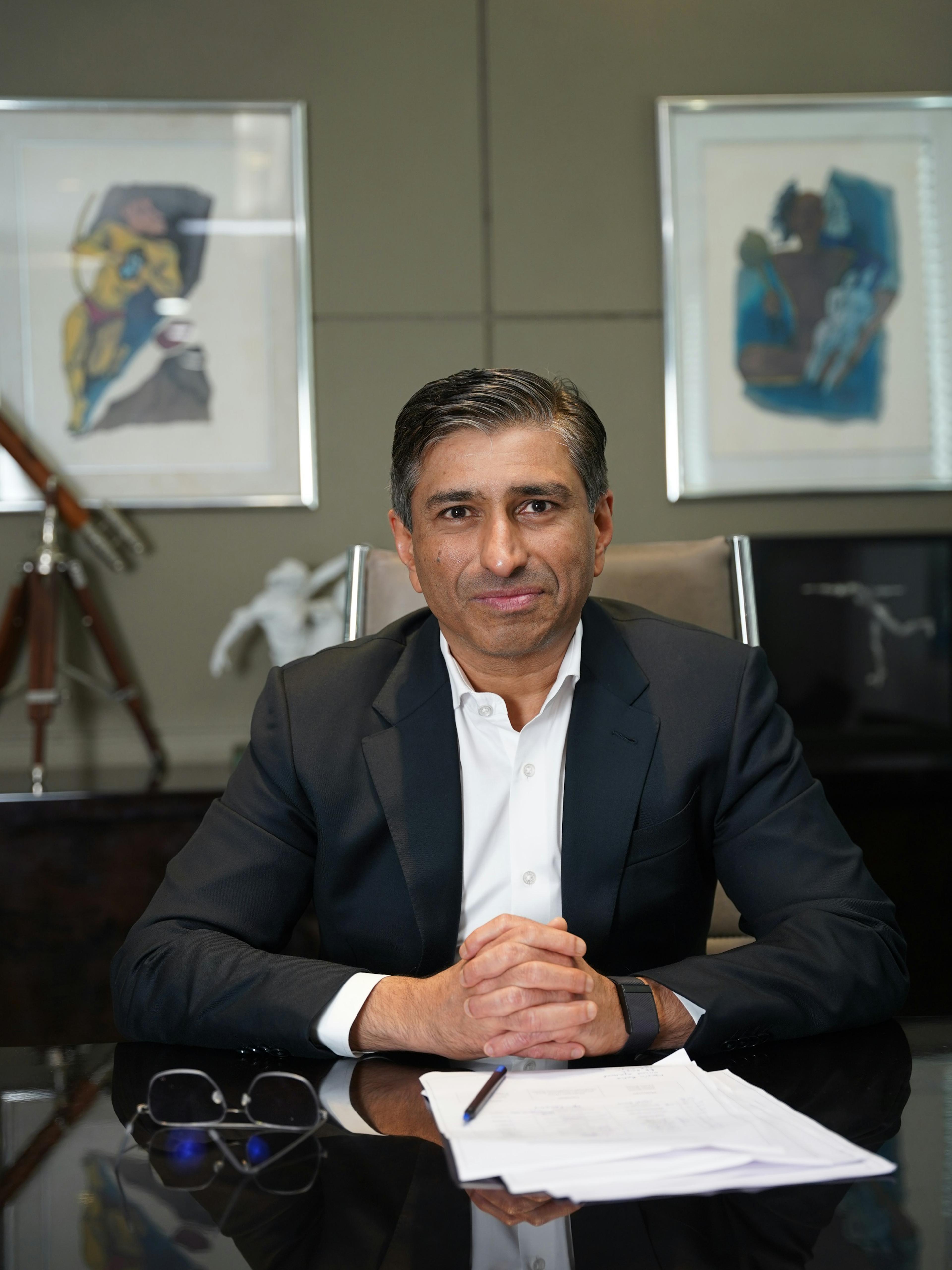 Attorney in a suit seated at a desk