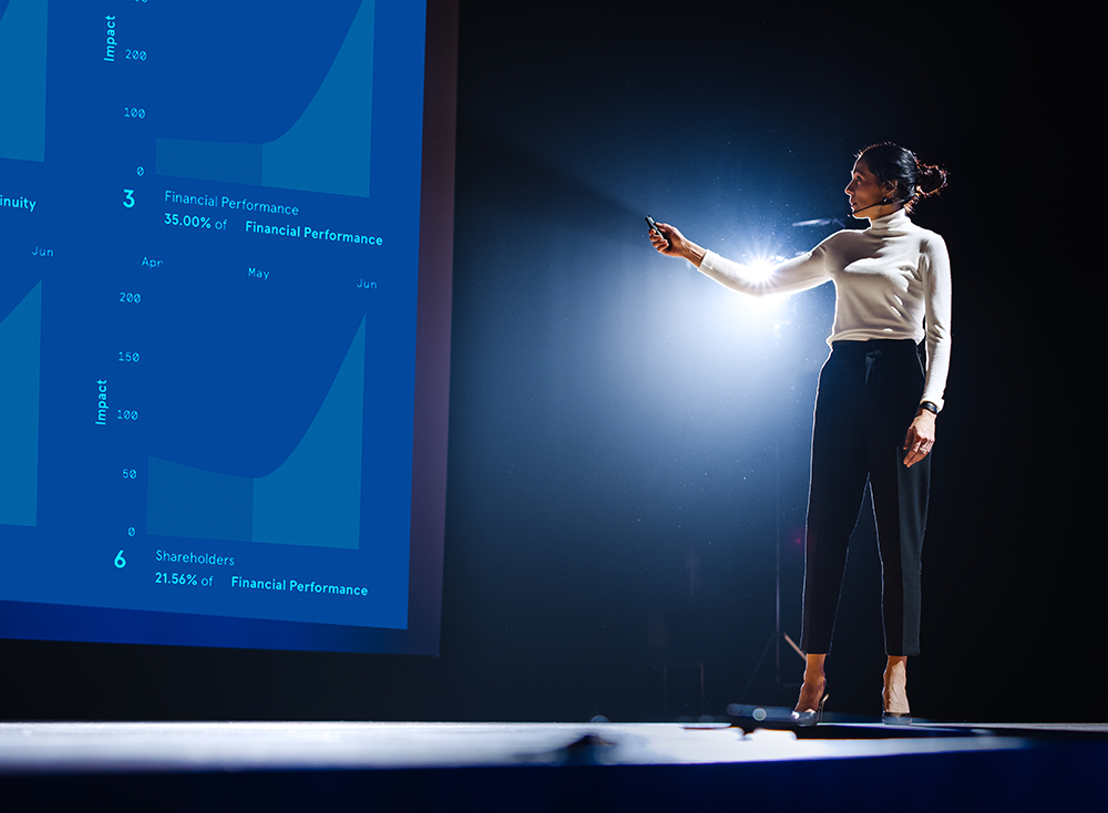 A photo of someone giving a keynote presentation on stage