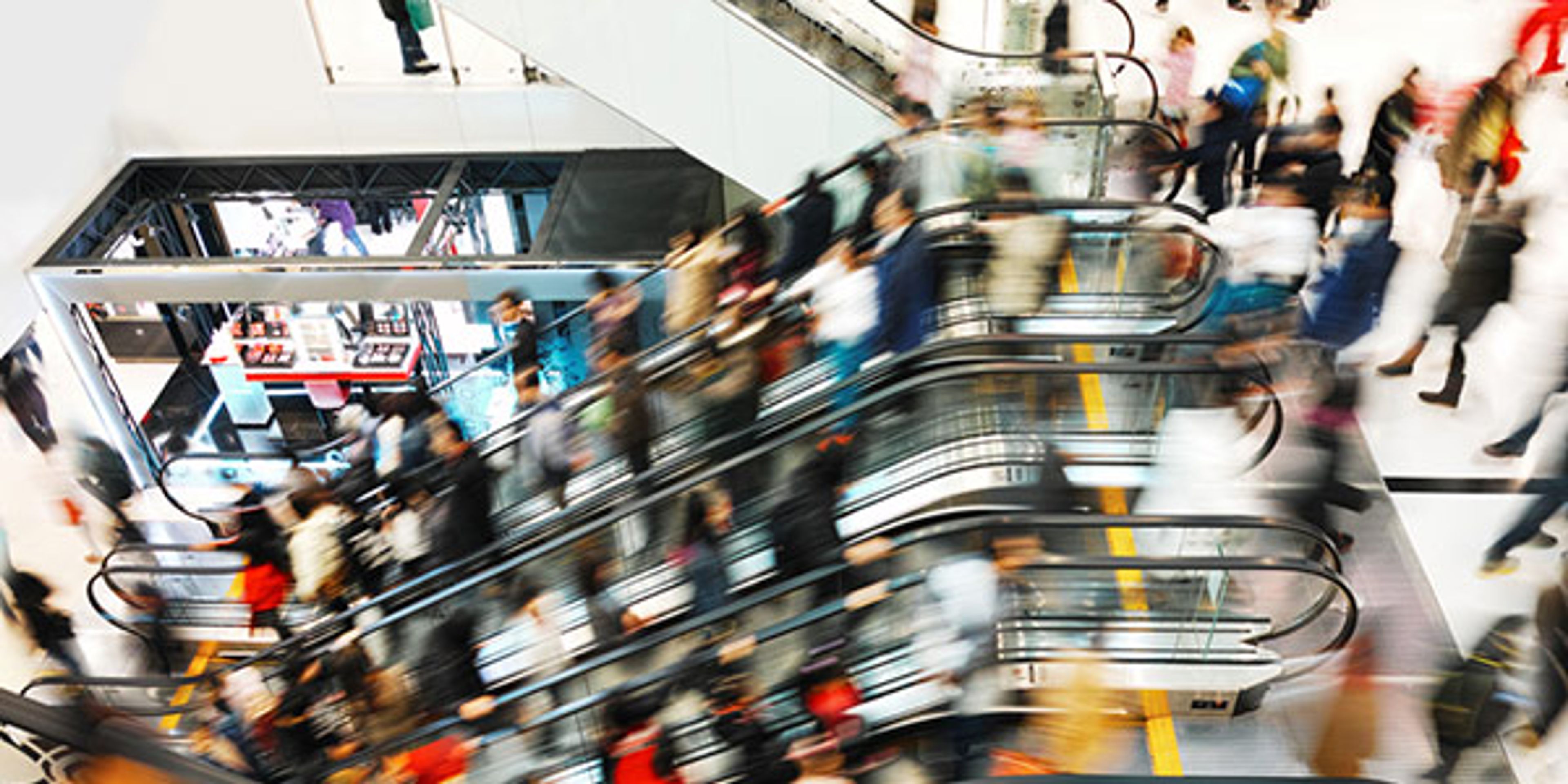 A photo of shoppers in a department store on Black Friday