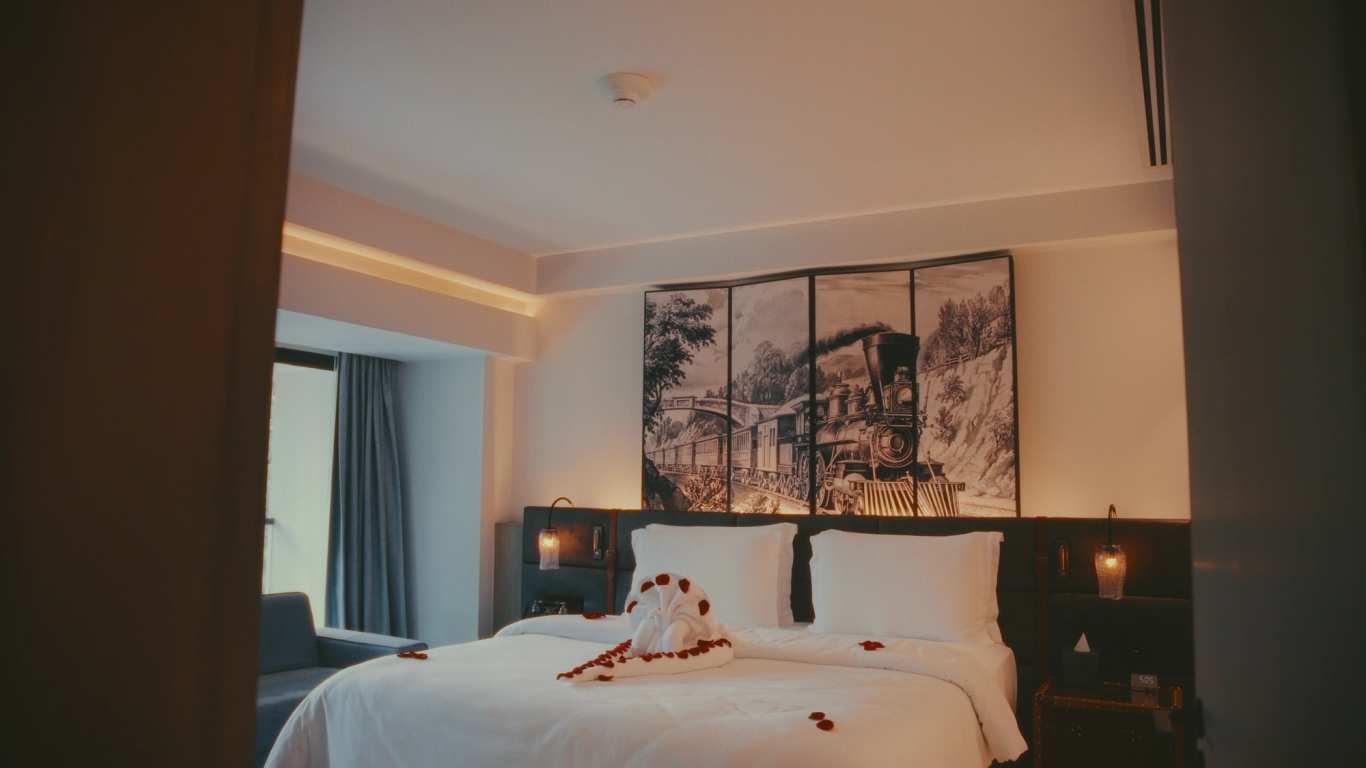 Luxury suite bedroom dressed with rose petals