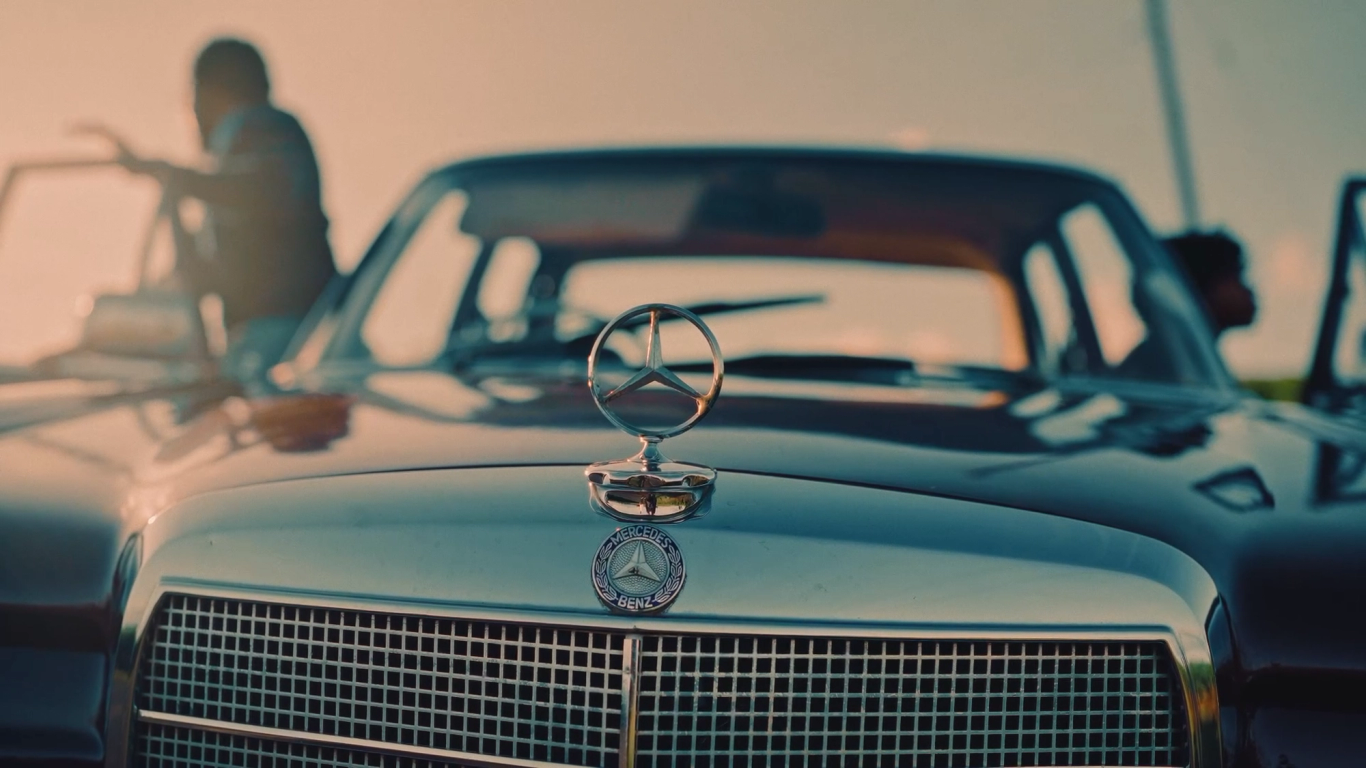 Silver vintage Mercedes grille and hood ornament