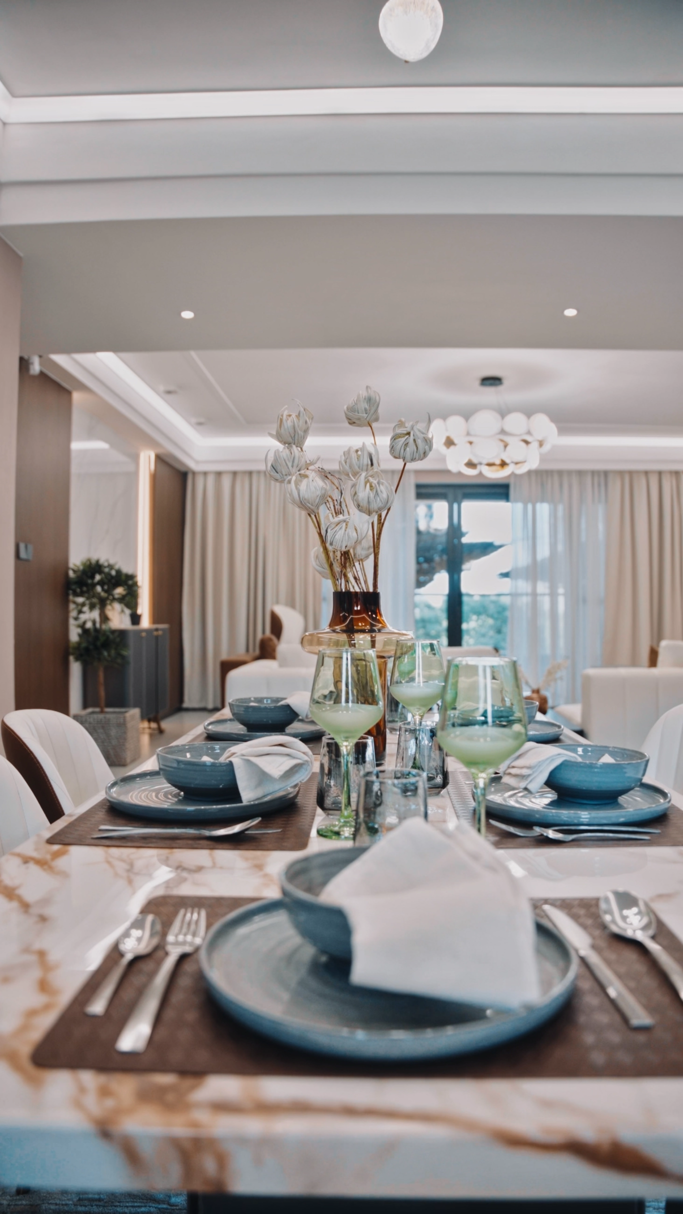 Dining table set with styled tableware and glassware
