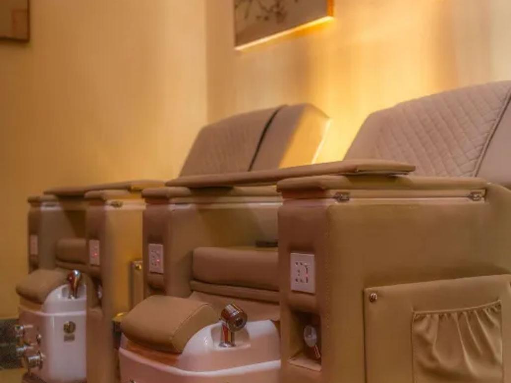 Foot and hand reflexology chairs ready to soothe and soak away the ache