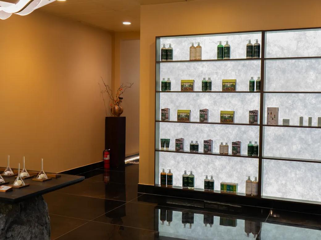 The skincare wall, warmly lit