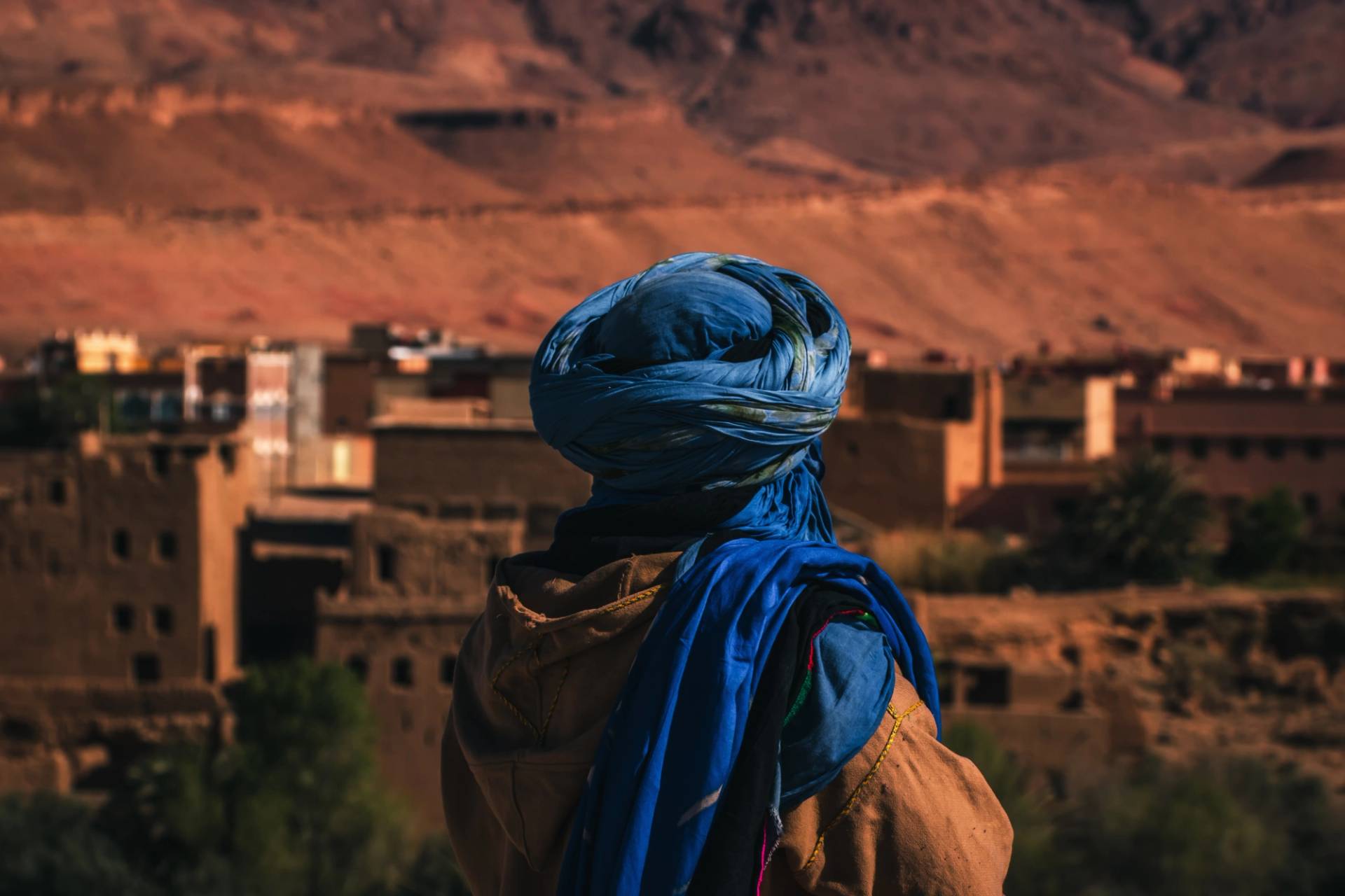 man from behind with a turban looking at Todra