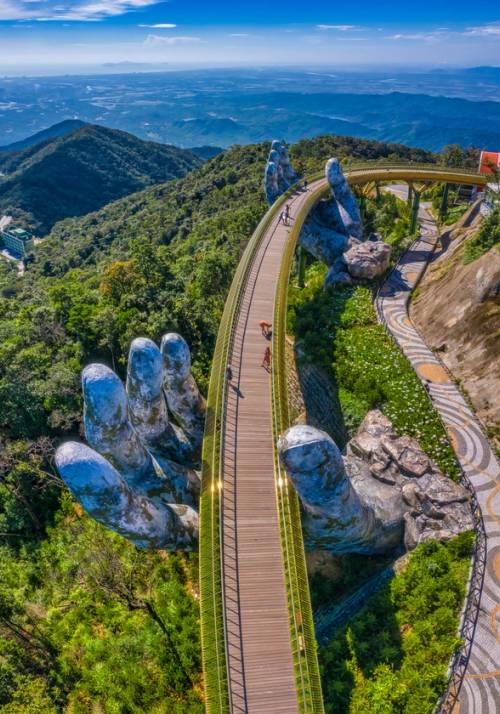 bridge supported by two hands