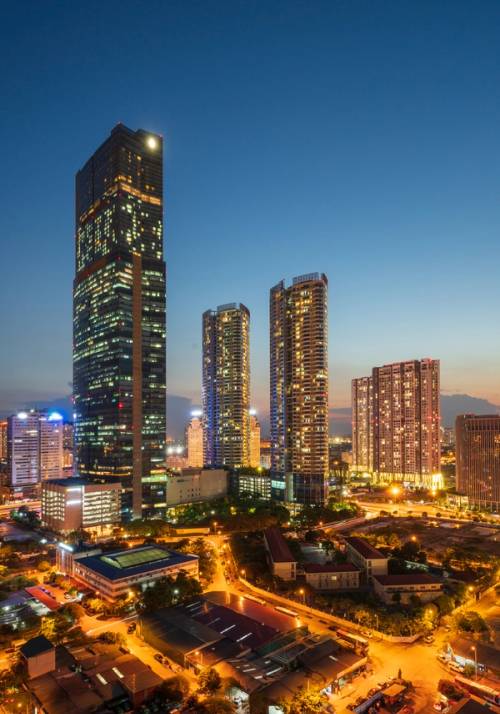 city lit up at sunset