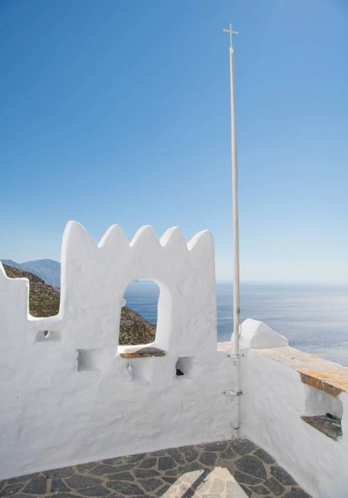 white Greek house with sea view