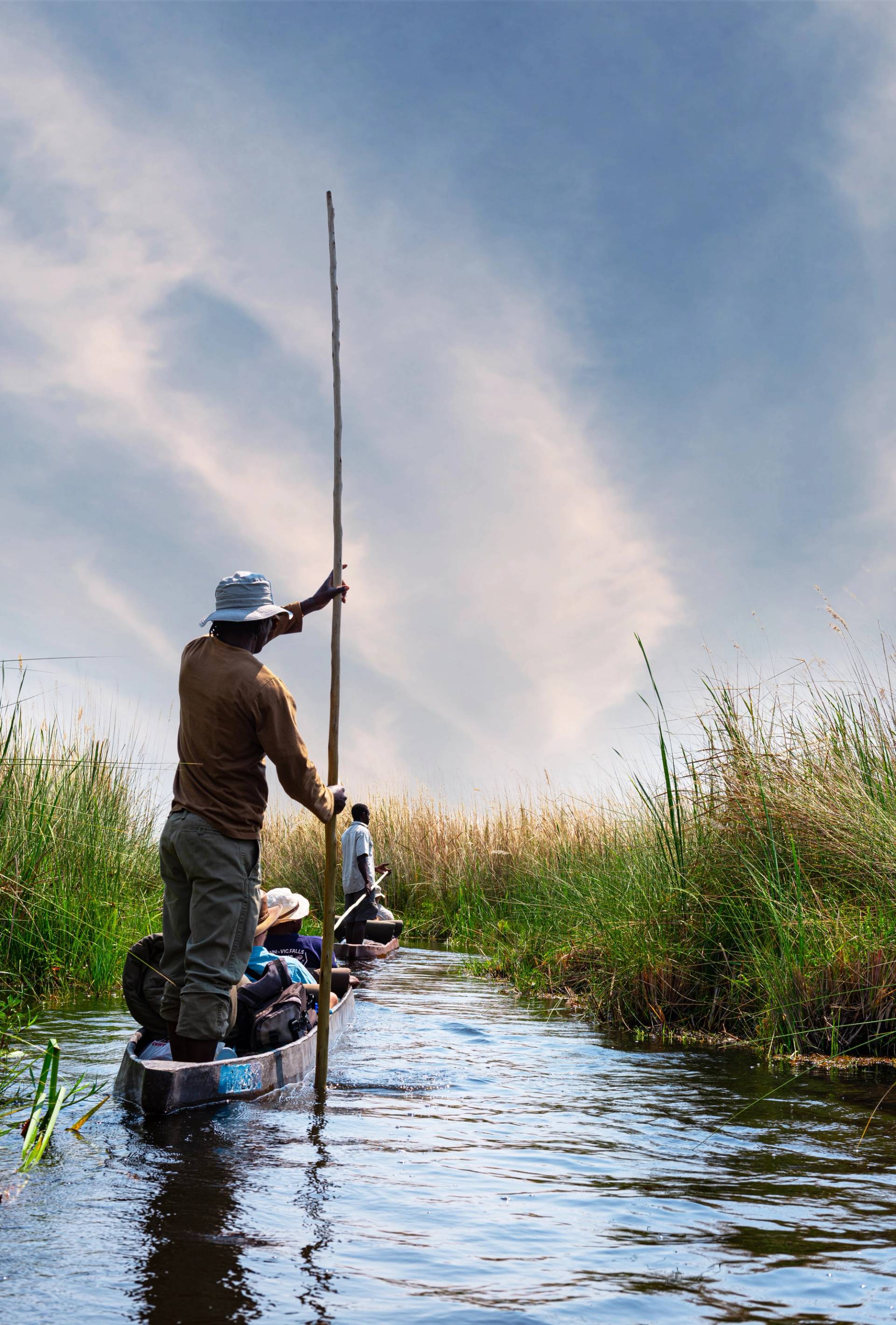 man on a boat in the Okavango Delta