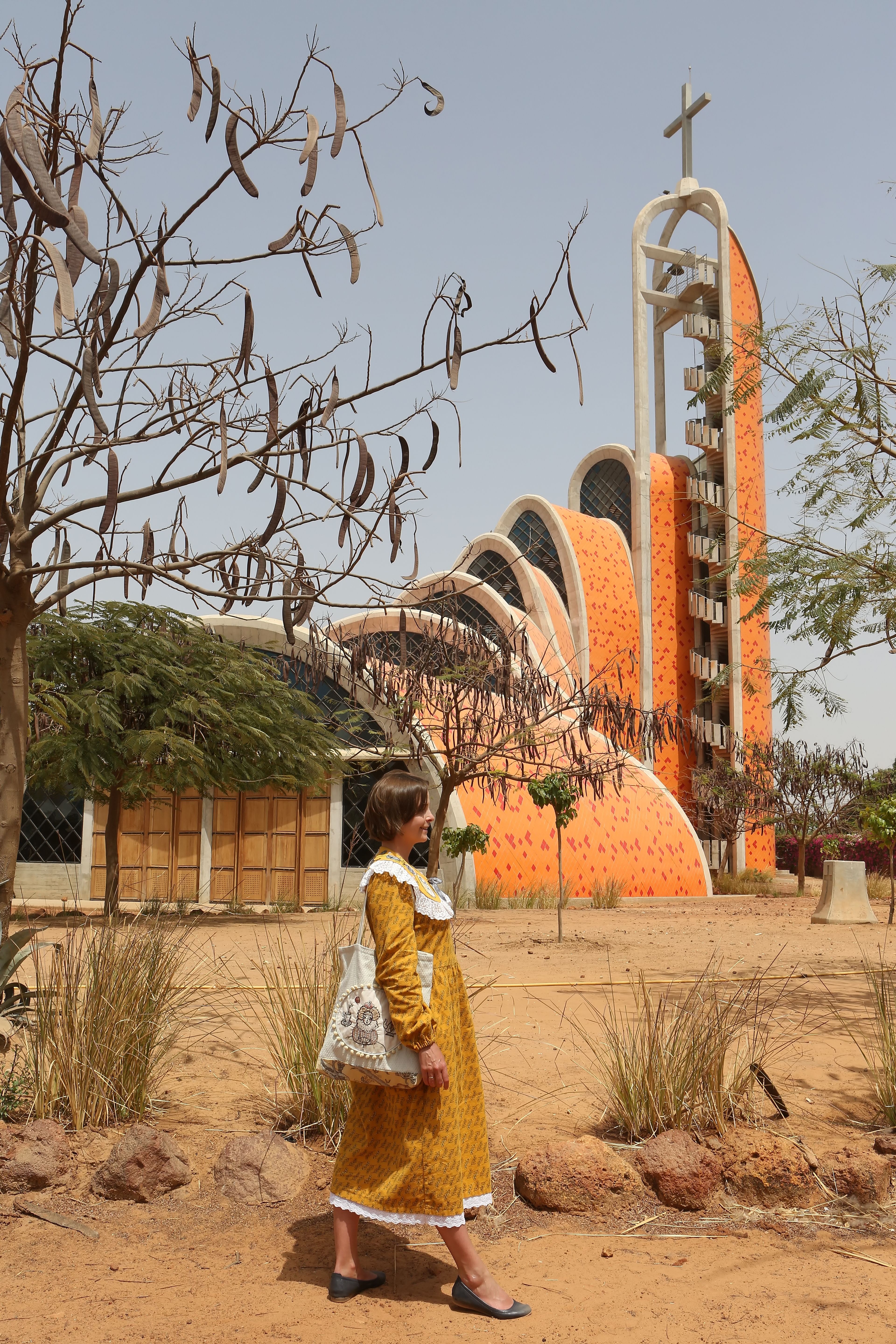 female tourist in front of architecture in Senegal
