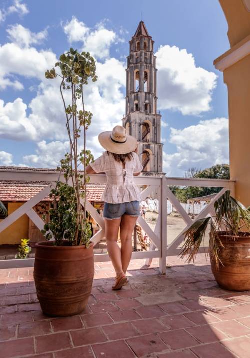 girl standing back looking at the square of Trinidad