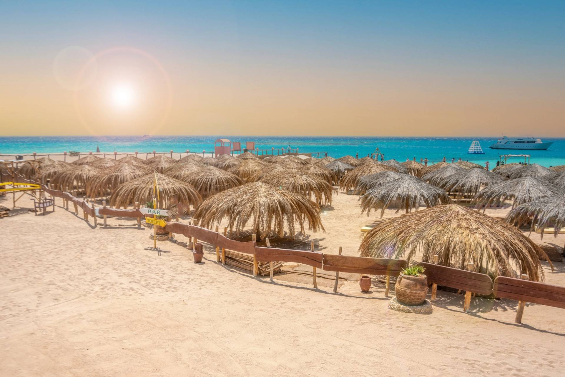 beach with straw umbrellas