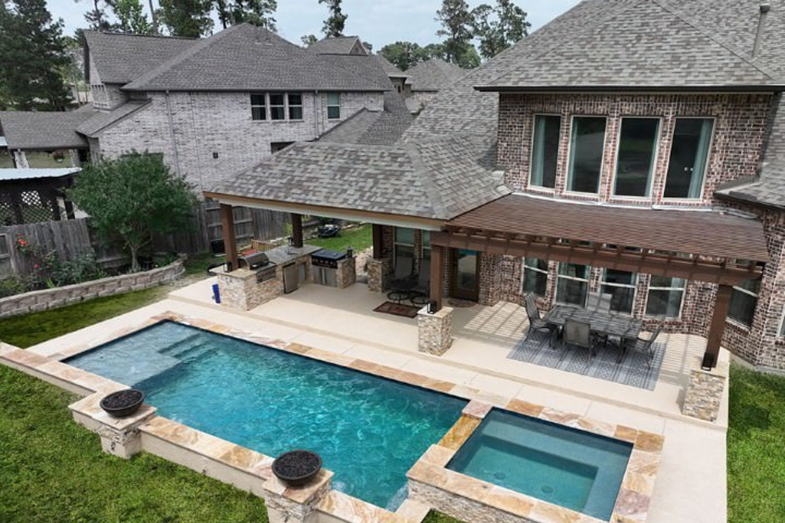 Covered patio and pergola to complement luxury pool