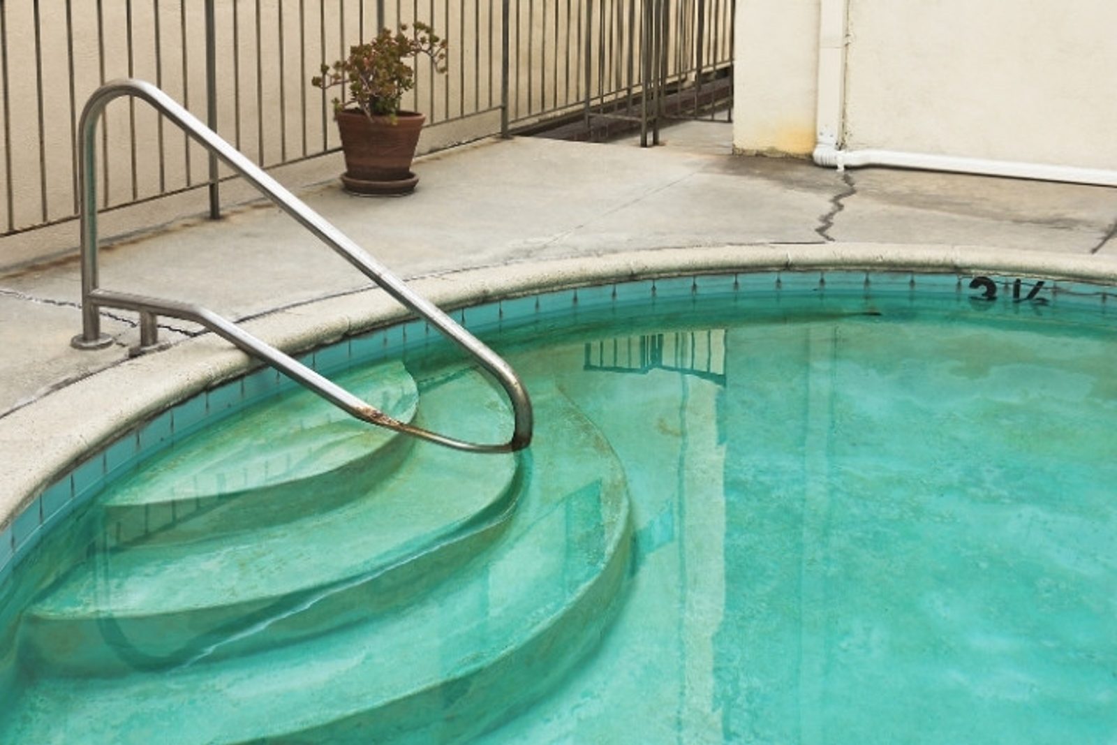 Stained pool surface with discolored waterline
