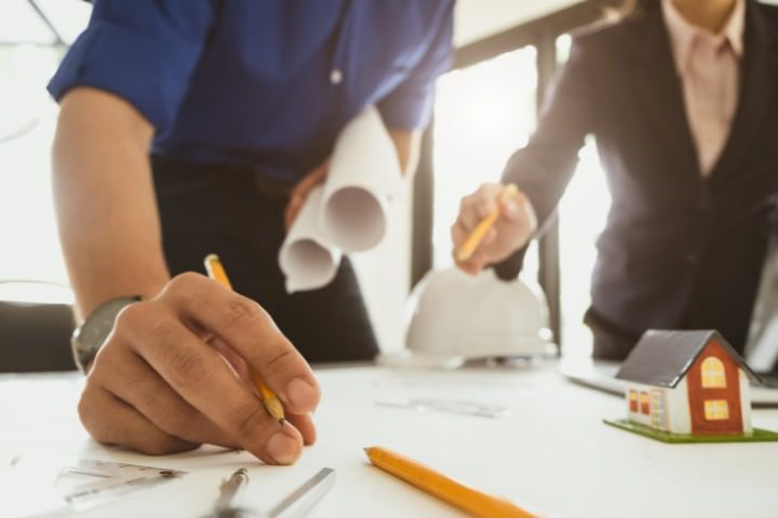 Professional home contractor reviewing outdoor living project plans in Houston