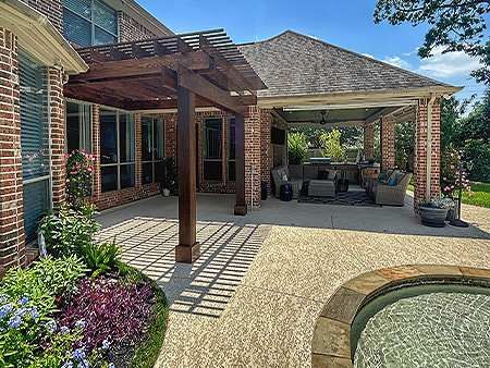 Backyard patio featuring a wooden pergola, outdoor seating area and swimming pool