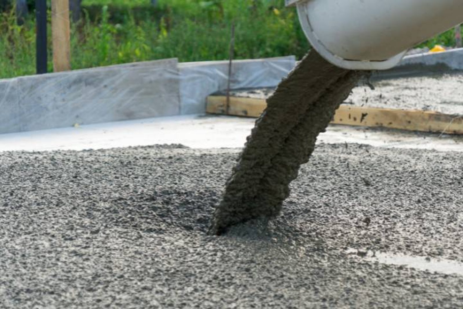 Concrete being poured for a Tomball pool construction foundation