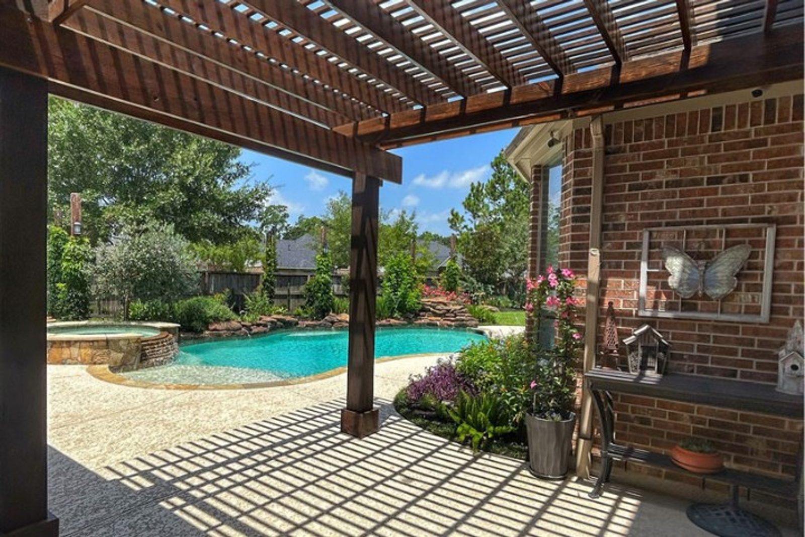 Outdoor space in Houston blending greenery and hardscaping for a balanced, timeless look