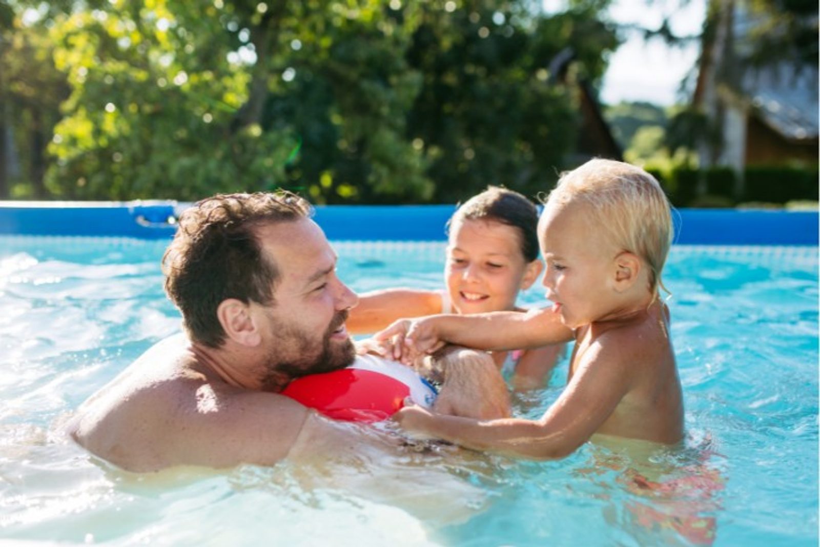 Parent supervising children as part of essential pool safety practices