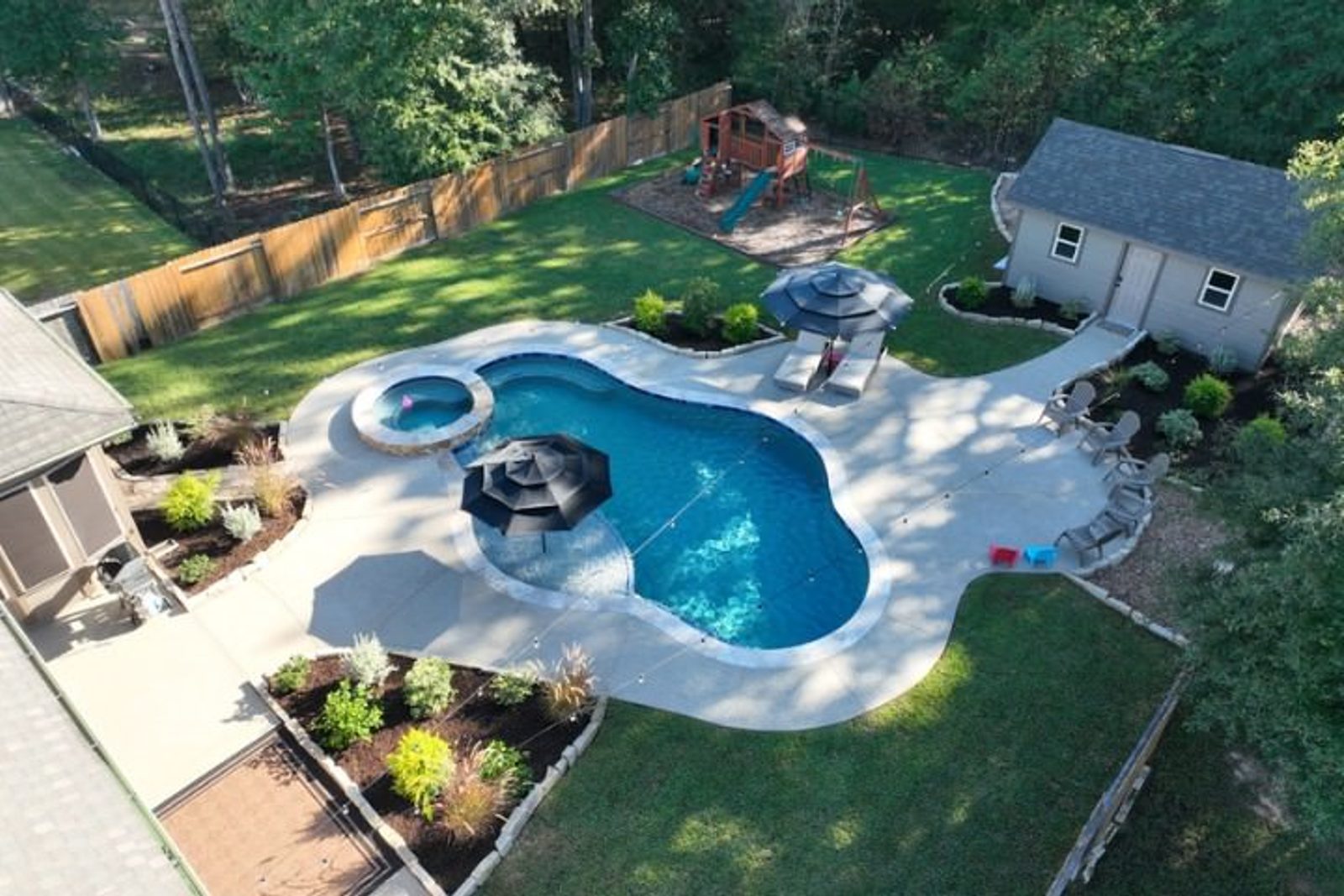 A beautifully landscaped outdoor space by GM Outdoor Living and Spa