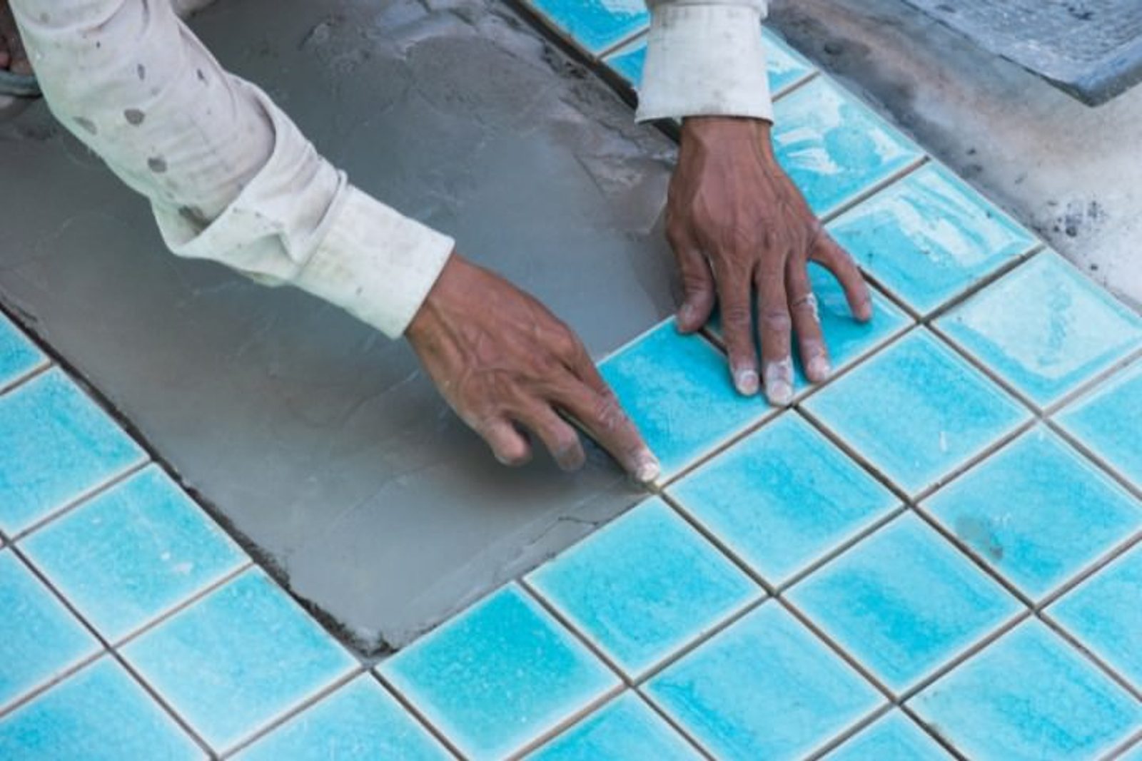 Tile installation enhancing the design and functionality of a Houston custom pool
