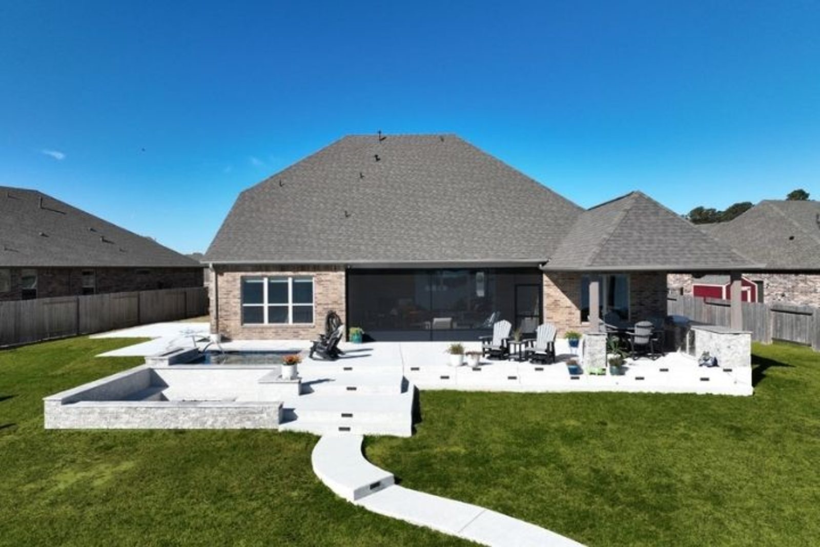 Houston backyard showing planned pool deck furniture placement