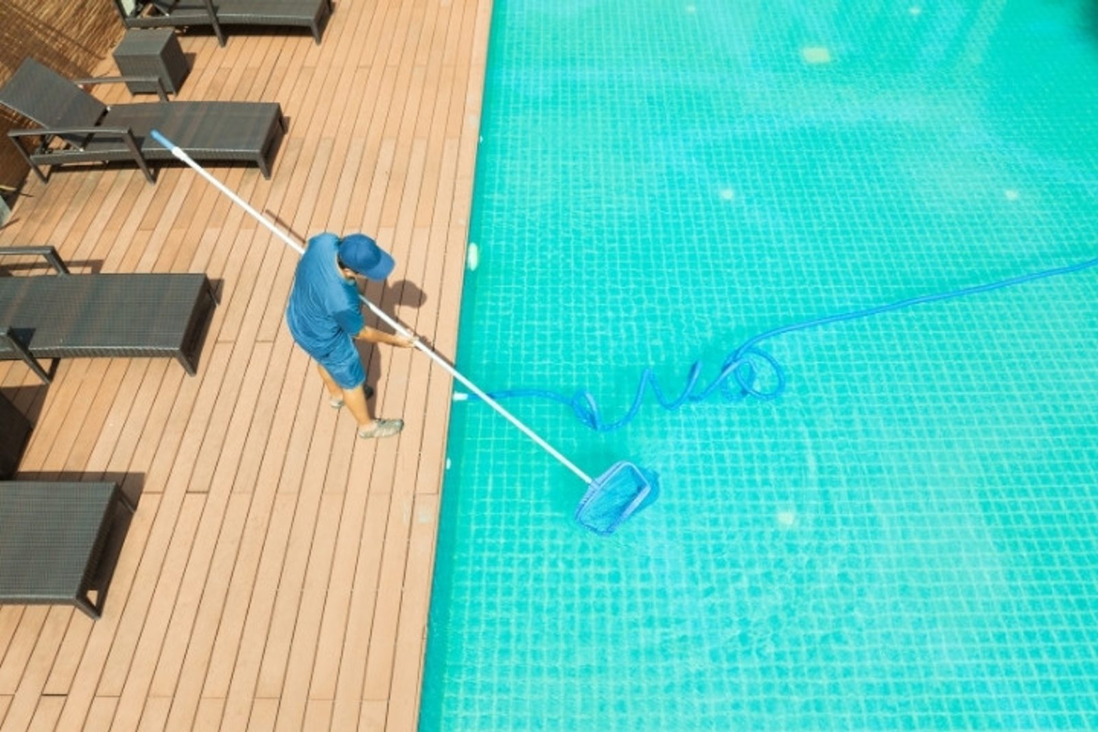 Pool service technician providing post construction maintenance