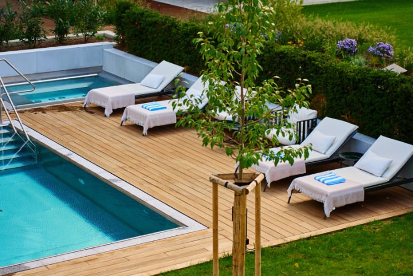 Outdoor space with sustainable wooden pool decking