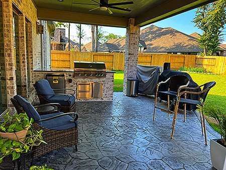 Backyard covered patio with built-in grill