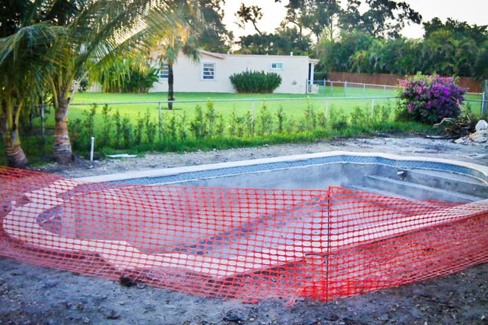 Temporary construction fencing used during pool installation