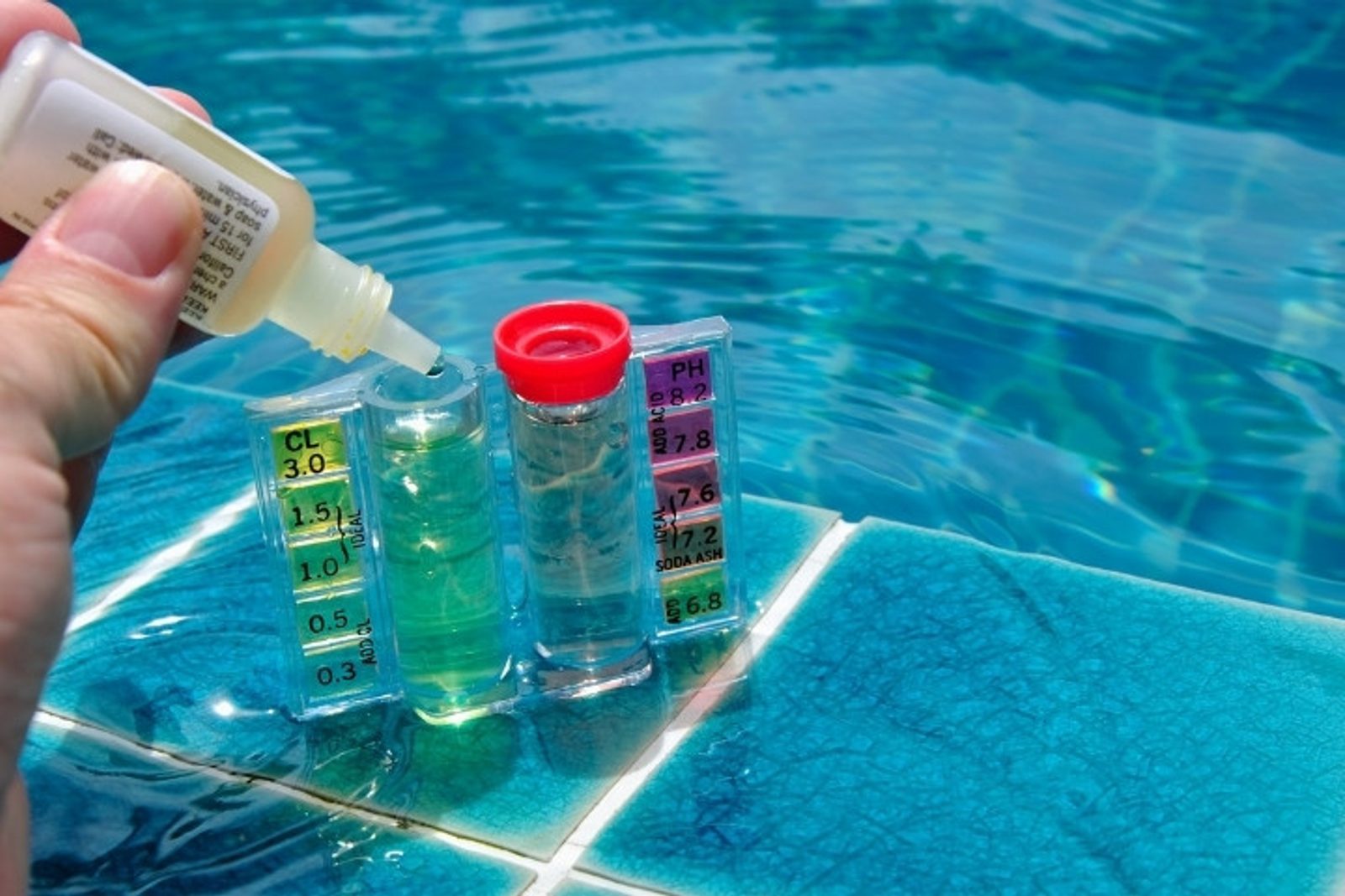 Pool water test kit checking chlorine and pH levels