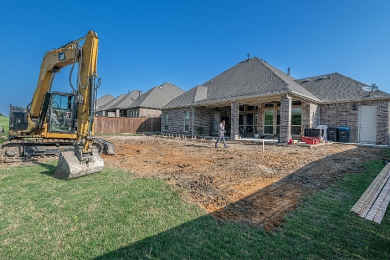 Excavation work for an outdoor living construction in a Houston backyard